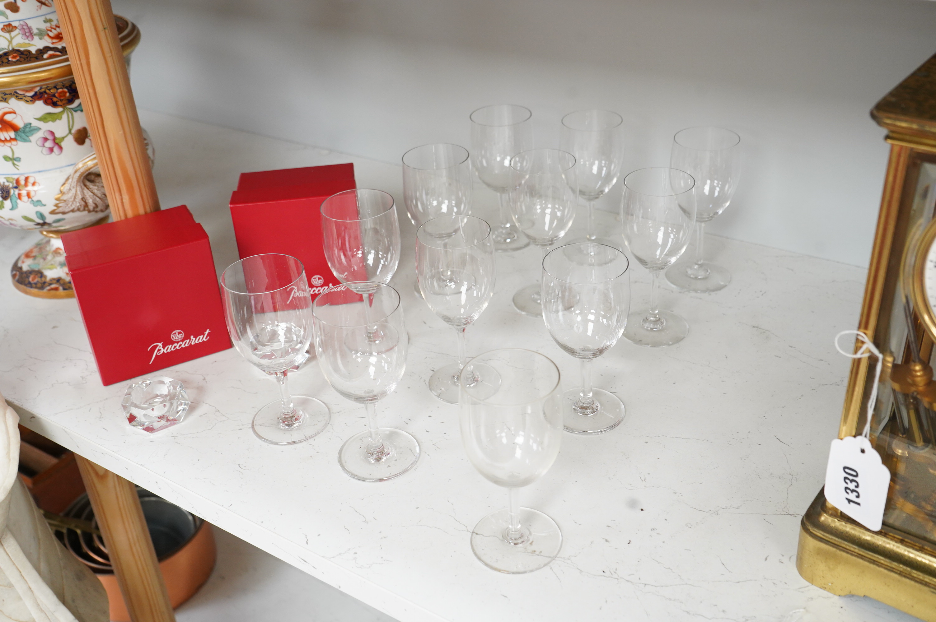 A set of twelve Baccarat crystal wine glasses and two tea light holders, with boxes, glasses 13cm high